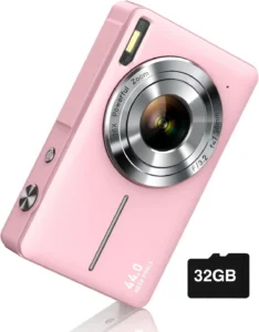 Pink digital camera with a powerful zoom lens and a 32GB memory card.