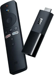 Xiaomi Mi TV Stick streaming device with Bluetooth remote featuring Netflix and Google Assistant buttons